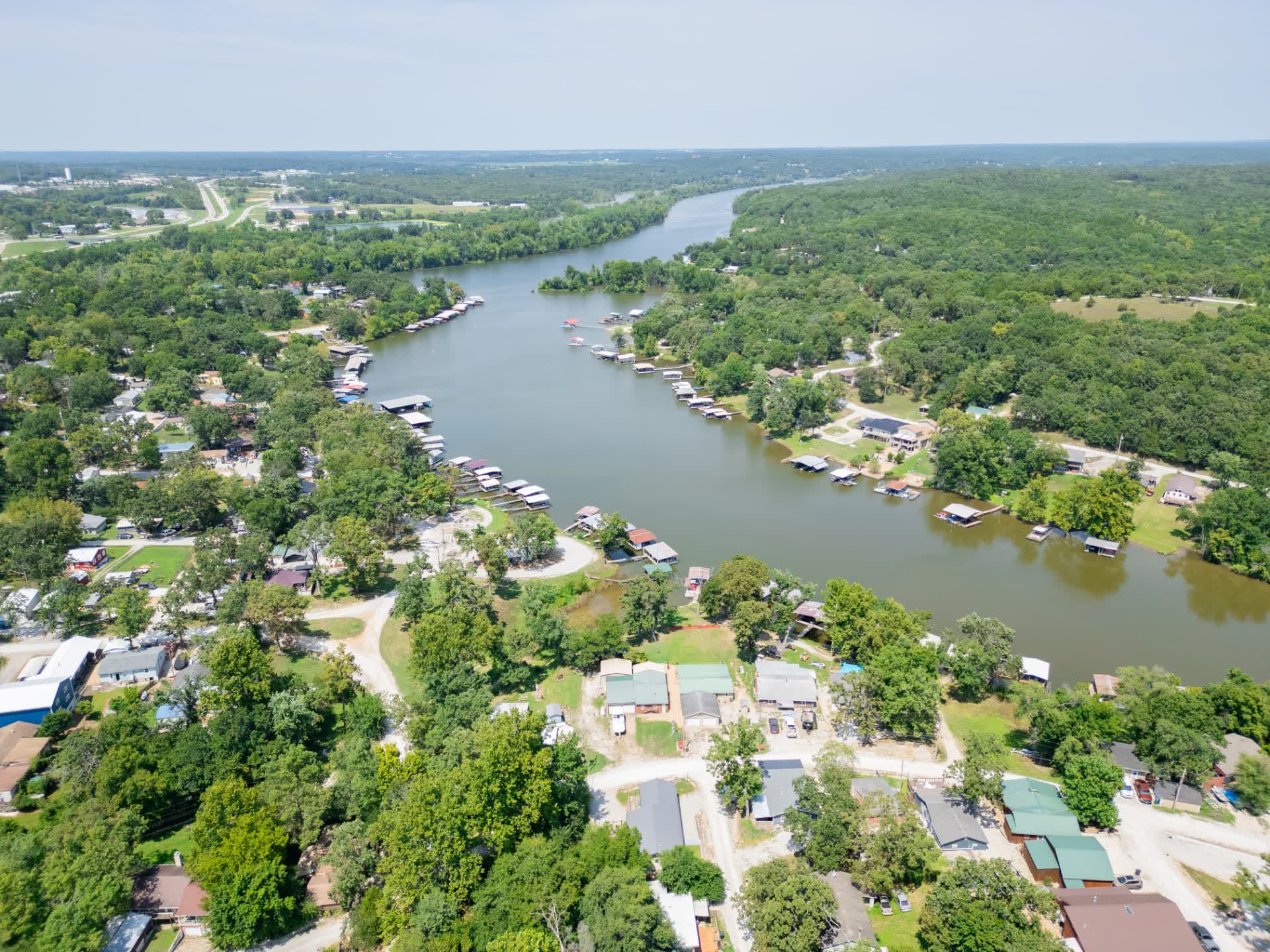 Aerial view of lake-area homes, docks and shoreline along a Missouri lake arm